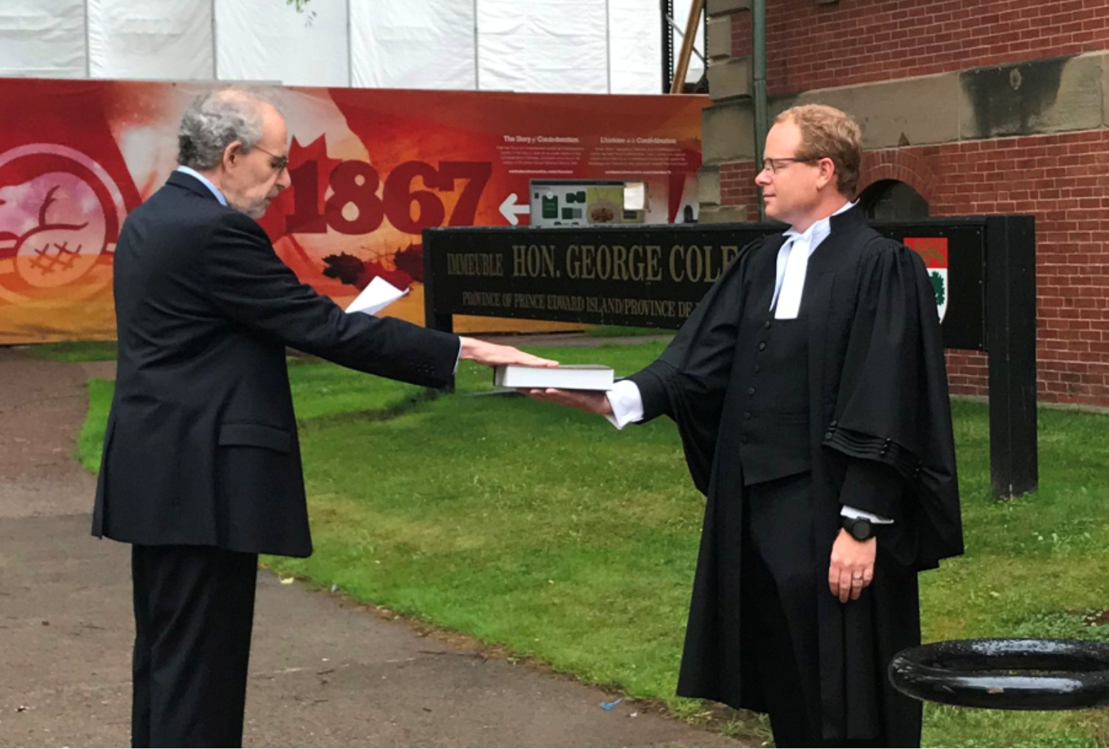 A photo of the Child and Youth Advocate swearing his oath of office.