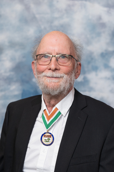 A photo of Ian Petrie, 2025 Order of PEI recipient, wearing the Medal of Merit.