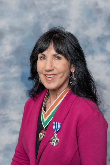 A photo of Kirstin Lund, 2025 Order of PEI recipient, wearing the Medal of Merit.