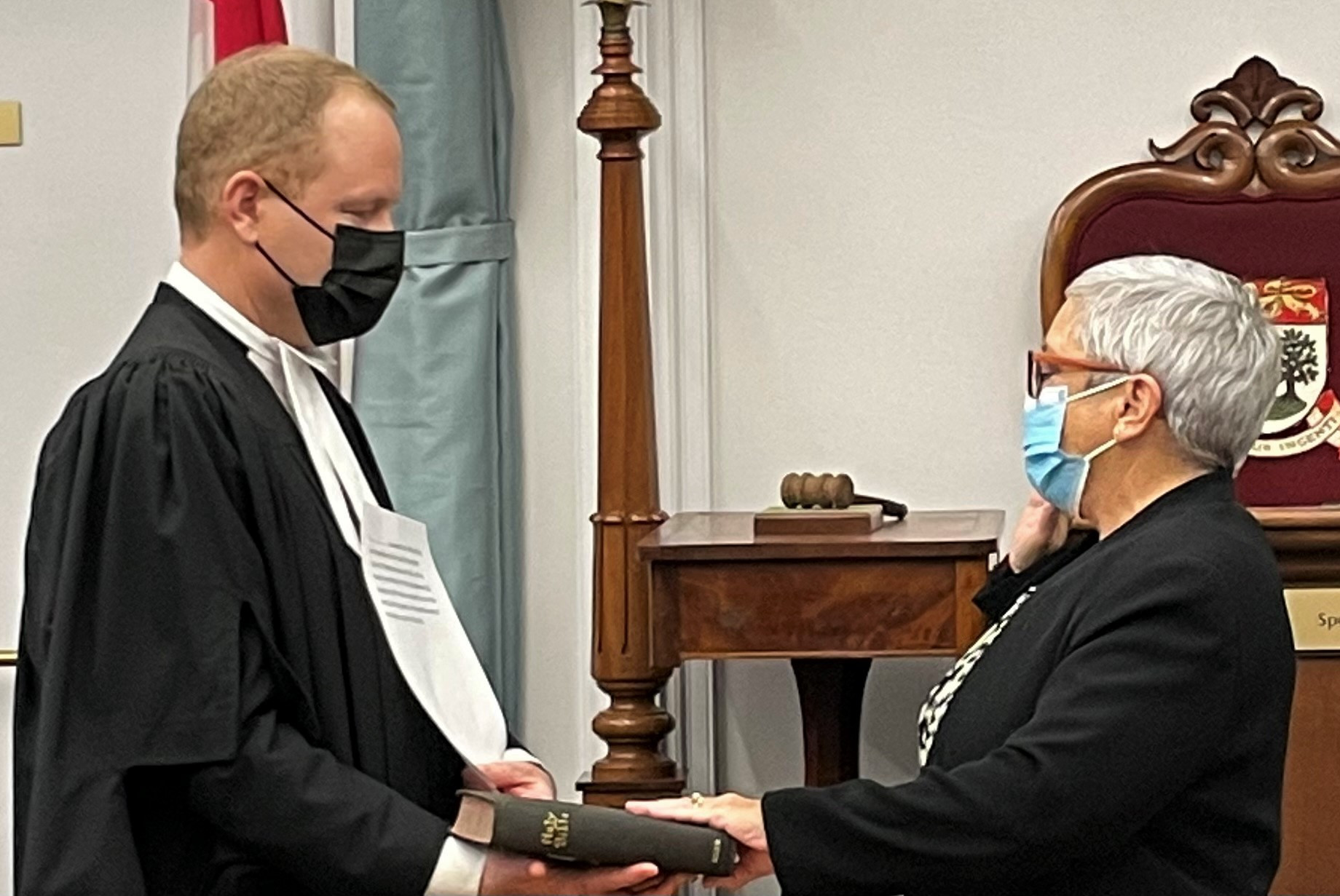 A picture of Joseph Jeffrey administering the oath of office to Sandra Hermiston, Ombudsperson for PEI.